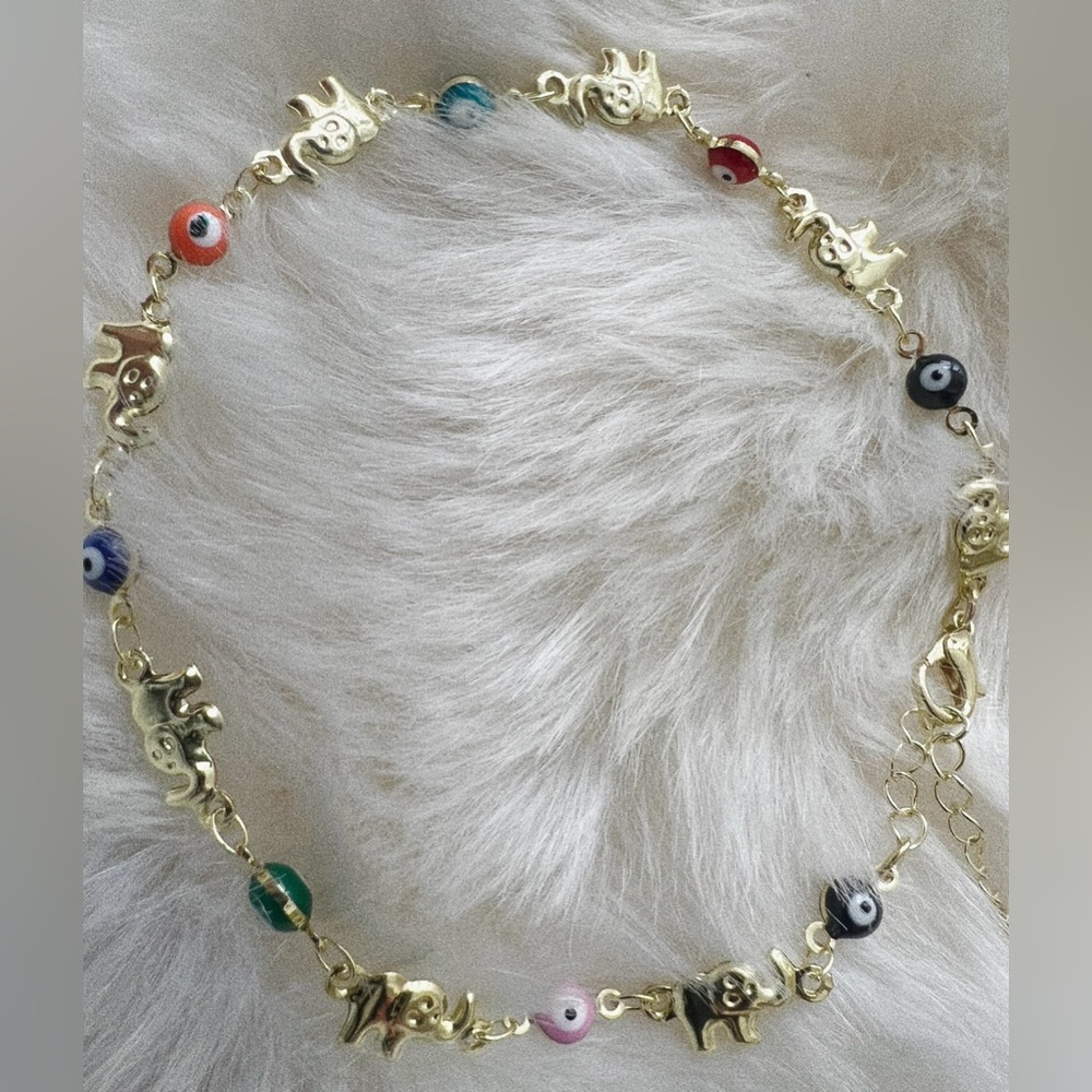 Gold tone Elephant Ojo anklet